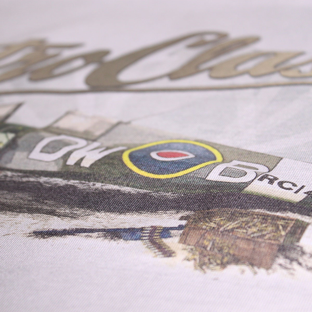 A WWII-era RAF Supermarine Spitfire Fighter Plane Soars Through A Pale Sky Propeller Spinning At Duxford England Image671985228