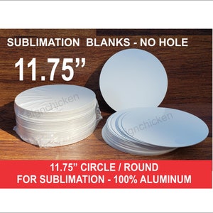 May include: White 11.75" round sublimation blanks, no hole, made of 100% aluminum. The image shows a stack of blanks wrapped in plastic and a few loose ones. Text on the image reads "SUBLIMATION BLANKS - NO HOLE".