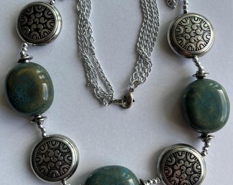 Southwestern inspired silver tone disc necklace with molted blue Clay beads