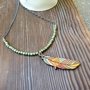 Necklace - Multi-Colored Wooden Feather with Sage Seed Beads