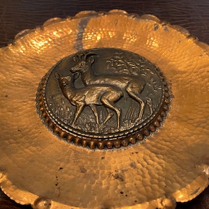 Copper plate with two deer in the center ready to Hang