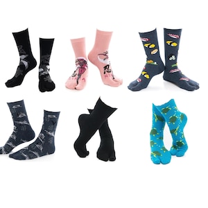 May include: Collection of split-toe socks in various colors and patterns. Designs include sushi, turtles, and abstract art. Colors include black, pink, blue, and navy. These socks are designed to be worn with traditional Japanese footwear.