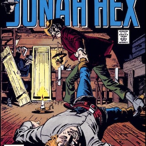 Peut inclure: Une couverture de bande dessinée représentant un homme en chemise rouge et pantalon noir debout au-dessus d'un homme allongé sur le sol. La couverture est intitulée "Jonah Hex" et comporte le texte "The Weirdest Western Hero Now In His Own Magazine!"