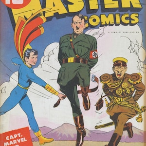 May include: A comic book cover featuring a red, yellow, and blue superhero character, Captain Marvel Jr., fighting two villains. The cover is titled "Master Comics" and features the text "Who's Hoodoo? Look Inside for Answer!" and "August No. 29".