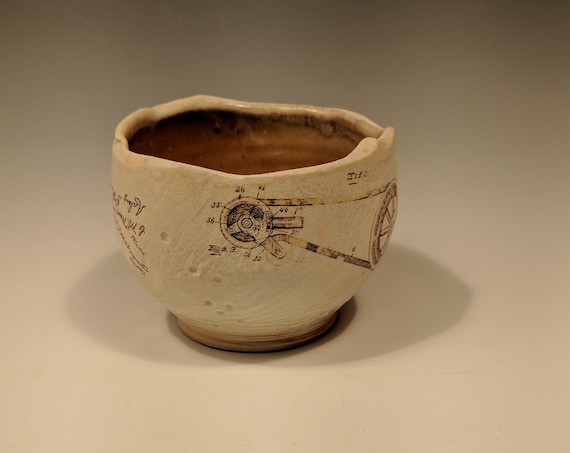 Handmade porcelain woodfire bowl, tea bowl, with gear and butterfly