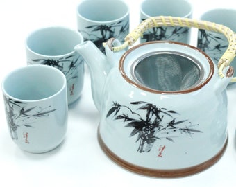 Ceramic Herbal Teapot Set - BLUE ORIENTAL with metal strainer in the lid and six matching cups.