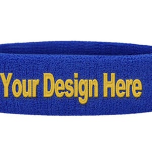 Puede incluir: Cinta para la cabeza de rizo azul con el texto bordado "Your Design Here" en amarillo. La cinta es de color liso y parece nueva.
