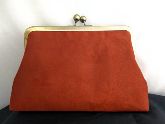 burnt orange clutch