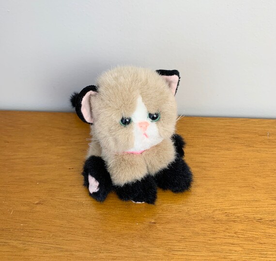 90s toy cat that purrs