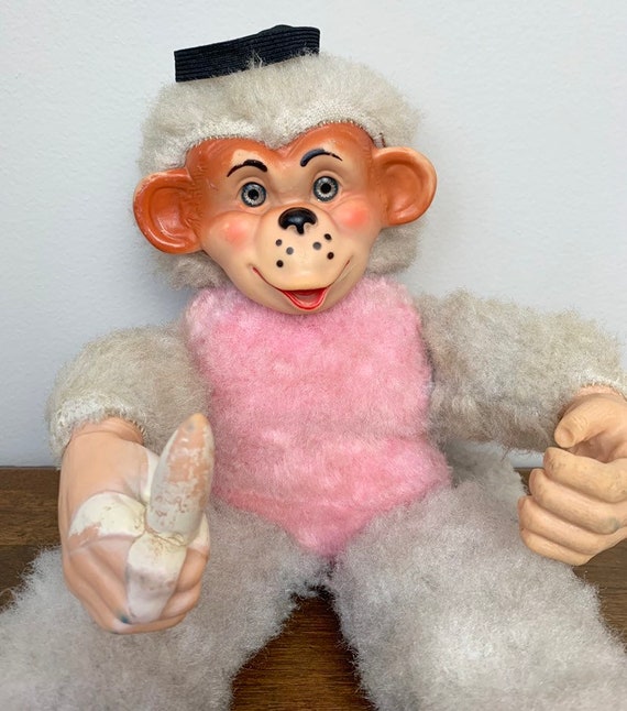 vintage stuffed monkey holding banana