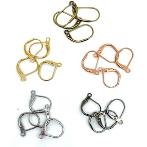 May include: Assortment of earring findings in four different colors: gold, rose gold, silver, and gunmetal. Each color is shown in a pile of five findings.
