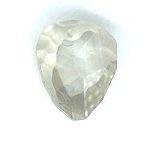 May include: A rough, clear, white diamond with a pear shape.