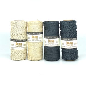 May include: Four spools of 100% hemp cord in natural, black, and gray colors. Each spool is labeled "The Bead Smith" and "100% Hemp Cord".