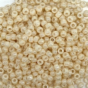 8/0 TOHO #123 Opaque-Lustered Lt Beige. Japanese Seed Beads. 20 grams tube or factory pack.