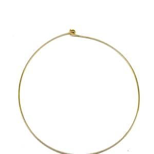 May include: A gold-toned metal choker necklace with a small ball clasp.