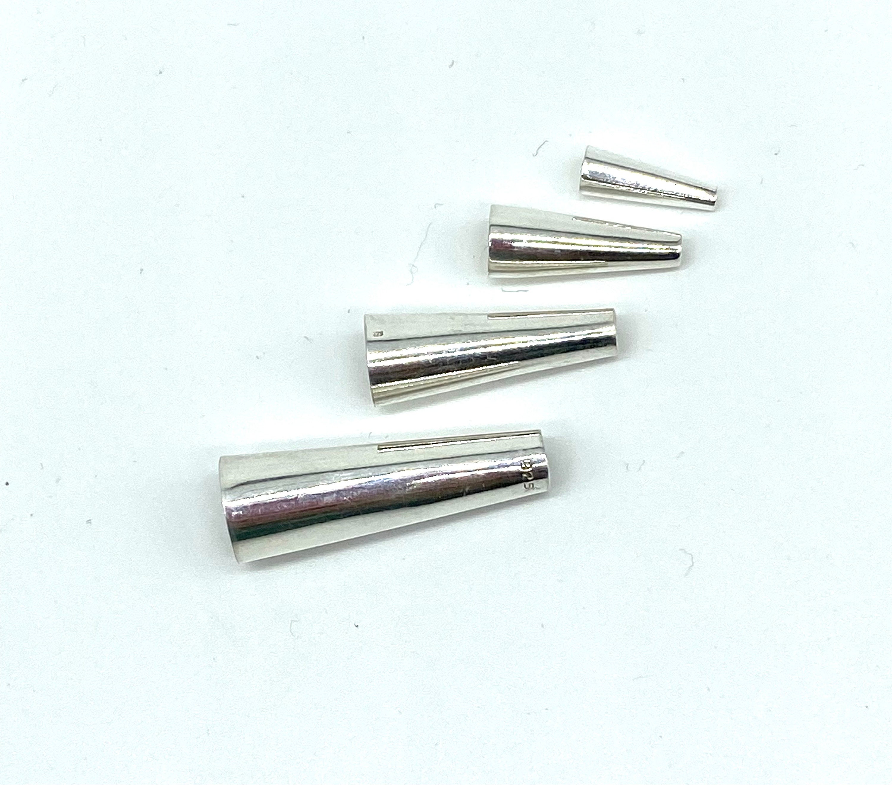 12 Packs: 23 Ct. (276 Total) Smooth Silver Bead Cones by Bead Landing