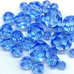4,5,6,8,10 mm Light Sapphire. #5000 Round Genuine Swarovski Crystal Beads. Choose size and Quantity.