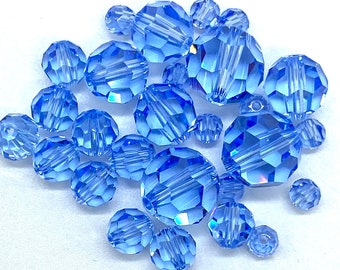 4,5,6,8,10 mm Light Sapphire. #5000 Round Genuine Swarovski Crystal Beads. Choose size and Quantity.