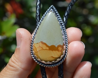 Handmade sterling silver and leather bolo tie featuring picture jasper