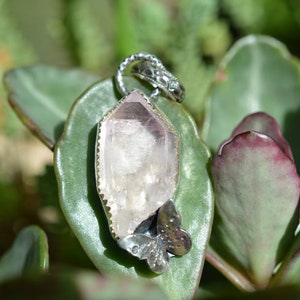 Handmade sterling silver pendant featuring a raw vera cruz amethyst point and butterfly//Tune In on the back