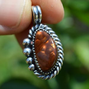 Handmade sterling silver red fire agate power pendant