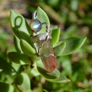 Handmade sterling silver pendant featuring an amphibole quartz point and labradorite