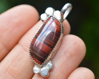 Handmade sterling silver pendant featuring a red jasper