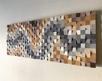 May include: A wall art piece made of wood blocks in various shades of brown, gray, and white. The blocks are arranged in a geometric pattern, creating a textured and modern look.