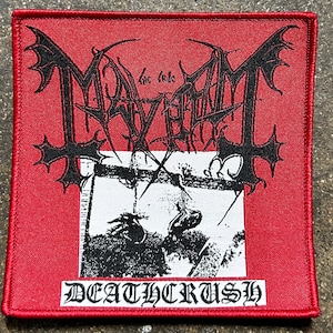 May include: A square, red patch with black text and a black and white image. The patch features the band name "Mayhem" in a gothic font, with the text "Deathcrush" at the bottom. The image is a black and white illustration.