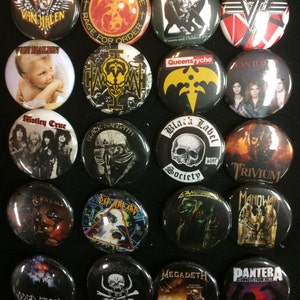 May include: A collection of 18 round metal pinback buttons featuring various rock bands, including Van Halen, Queensryche, Black Sabbath, Motley Crue, and Megadeth. The buttons are colorful and feature band logos, album covers, and band member images.