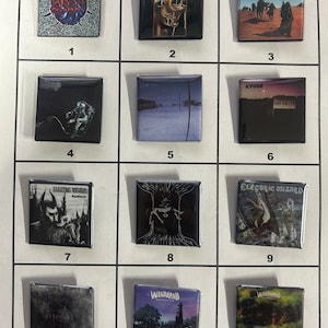 May include: Twelve square metal pins with album covers printed on them. The album covers are from various rock and metal bands, including Sleep, A Perfect Circle, Kyuss, Electric Wizard, and Windhand.