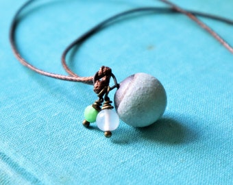 Pendant with vintage glass beads and pottery clay