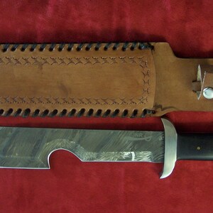 Custom hand made blaze pattern Damascus steel Survival knife with custom handmade leather sheath.