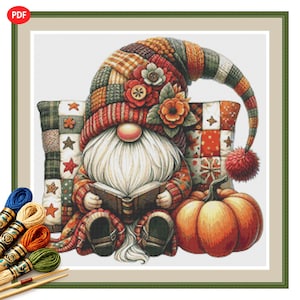 May include: A cross-stitch pattern featuring a gnome with a long white beard reading a book, wearing a tall patchwork hat with floral accents. The gnome sits before a patchwork pillow with star motifs next to a large orange pumpkin.