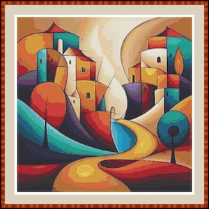 Può includere: Arte astratta a punto croce raffigurante una colorata scena di villaggio. L'opera presenta edifici nei toni dell'arancione, giallo, verde acqua e bianco, con una strada gialla tortuosa. Il pezzo è incorniciato in una cornice di legno marrone.