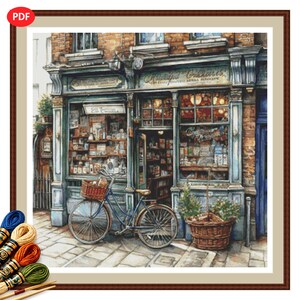 Patrón de punto de cruz en PDF de una antigua tienda, nº 6: antigua botica con bicicleta.