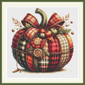 May include: A patchwork pumpkin with a red and black checked bow, surrounded by autumn foliage and buttons.