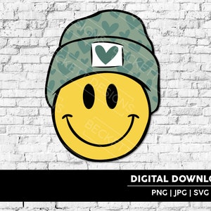 May include: A yellow smiley face wearing a green beanie with a heart pattern. The beanie has a small white heart on the front.