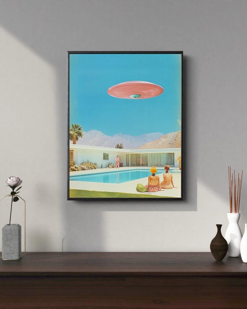 May include: A retro-style illustration of a pink flying saucer hovering over a suburban home with a swimming pool. Two people are sitting by the pool, looking up at the saucer.