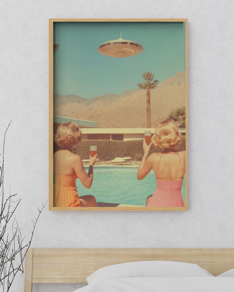 May include: Two people in swimsuits are sitting by a pool, looking up at a flying saucer in the sky. They are holding glasses of orange juice. The scene is set in a desert landscape with palm trees and mountains in the background.