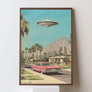 May include: A pink vintage car drives down a palm tree lined street in a desert town. A flying saucer hovers above the car.