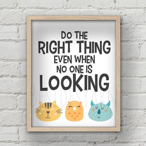May include: A framed print with the text "Do the right thing even when no one is looking" in black text. The print features three cartoon animal faces: a yellow cat, an orange owl, and a blue monster.