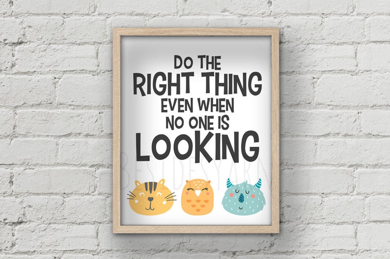 May include: A framed print with the text "Do the right thing even when no one is looking" in black text. The print features three cartoon animal faces: a yellow cat, an orange owl, and a blue monster.