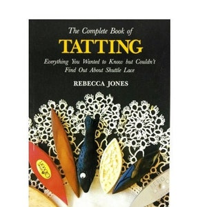 May include: A book titled The Complete Book of TATTING: Everything You Wanted to Know but Couldn't Find Out About Shuttle Lace by Rebecca Jones. The cover features a black background with white lace patterns and five various tatting shuttles.