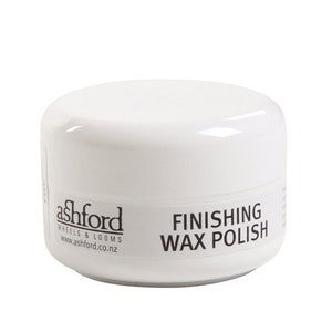 May include: White jar with black text that reads "Ashford Wheels & Looms www.ashford.co.nz" and "Finishing Wax Polish".