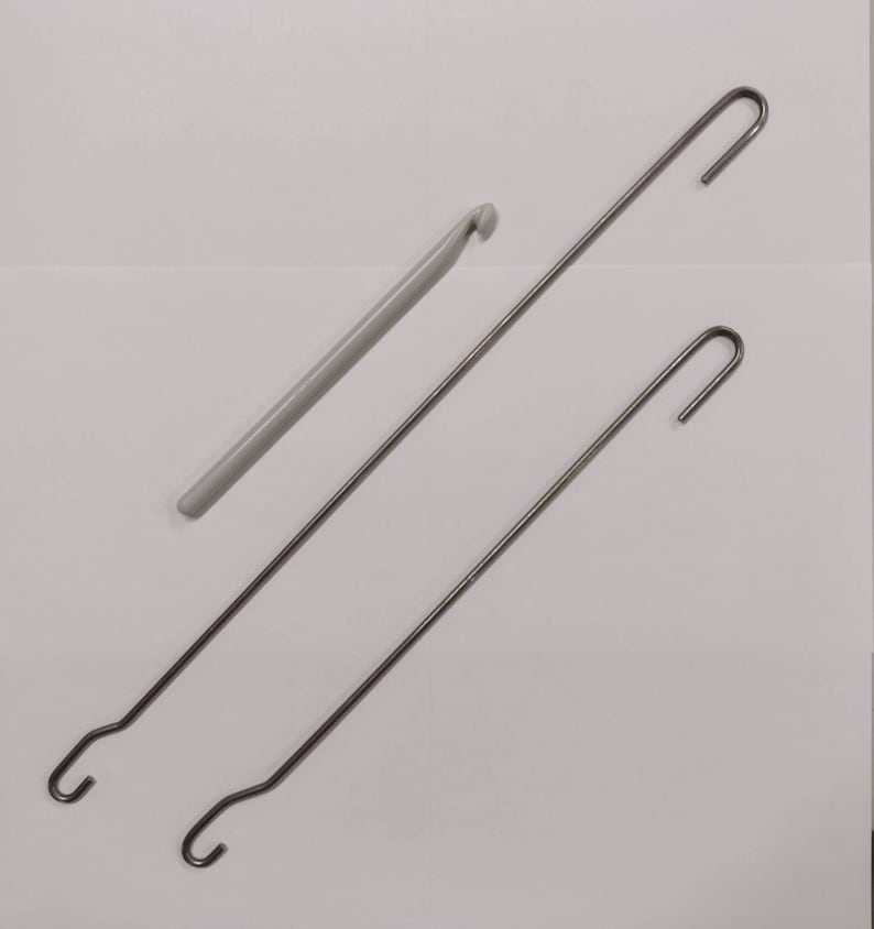 Three types of hooks offered, the plastic crochet hook, the long double ended weaving hook, and the shorter double ended weaving hook.