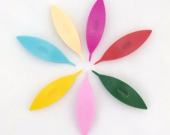 Boye tatting shuttle with point.  Plastic. 2.75 inches long, with center post. Pink, Ivory, Red, Green, Blue, Yellow, Fuchsia