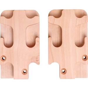 May include: Two wooden wall-mounted coat rack pieces. Each piece is rectangular with rounded corners and a light wood grain. They feature carved-out sections for hanging items and two pre-drilled holes for mounting.