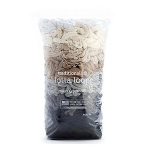 May include: A bag of traditional size "lotta loops" in beige, brown, gray, and white colors. The bag is labeled "friendly loom" and states that it makes 6 potholders. The bag also states "Quality cotton loops made in the USA".