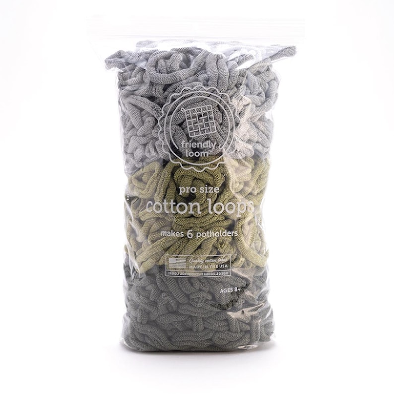 May include: A clear plastic bag filled with gray and olive green cotton loops for making potholders. The bag has a label that reads "friendly loom pro size cotton loops" and "makes 6 potholders". The product is made in the USA and is for ages 8+.